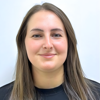 Headshot of Rae smiling at camera.