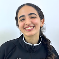 Headshot of Nada smiling at camera.