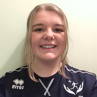 Daisy Pearson smiling at camera.