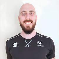 Headshot of Reece smiling at camera.