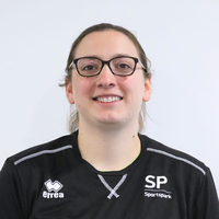 Headshot of Sarah smiling at the camera.