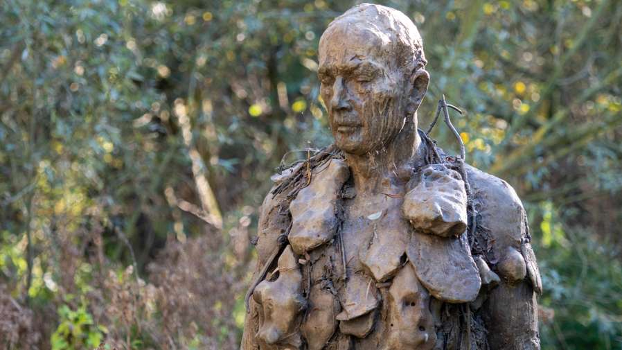 Laurence Edwards' Man of Stones sculpture by the lake