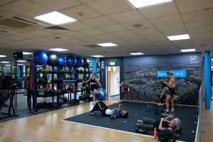 people in the fitness centre stretching area