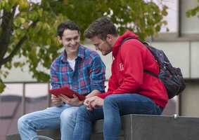 Students talking with iPad
