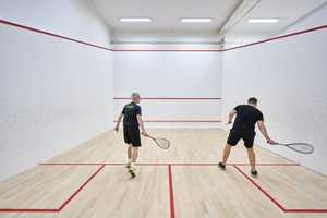 two people playing a squash match