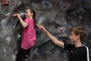 children using the climbing wall