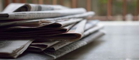 Stack of newspapers on a table