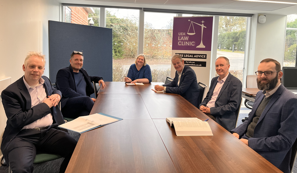 law clinic advisors sitting around a table