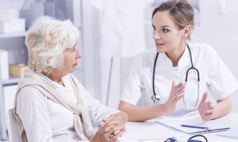 Patient and Healthcare worker sitting and talking
