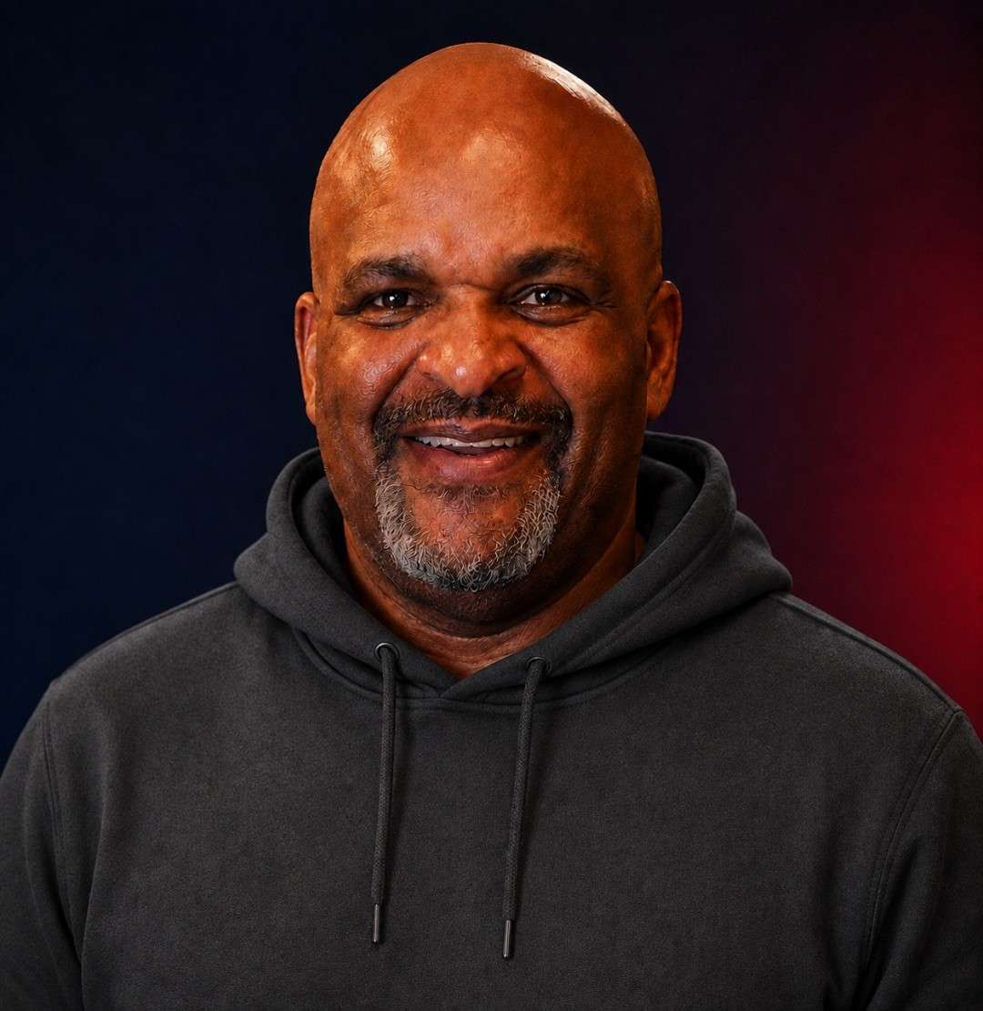 A portrait photo of someone smiling at the camera.