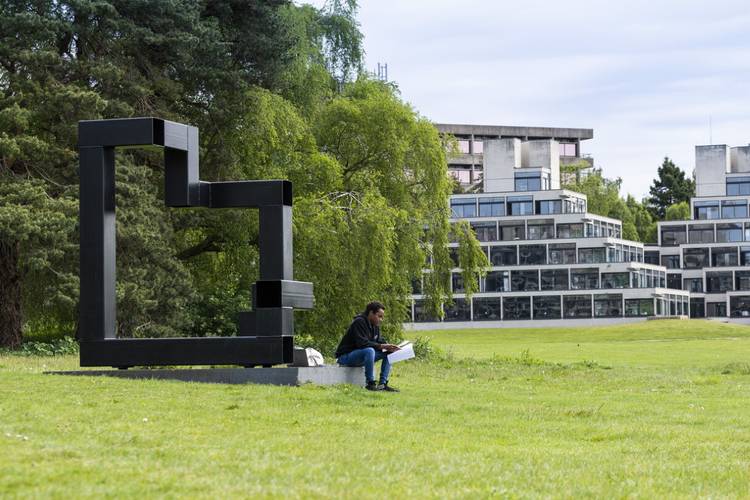 Student sat outside ziggurats