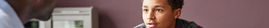 young boy talking to a therapist