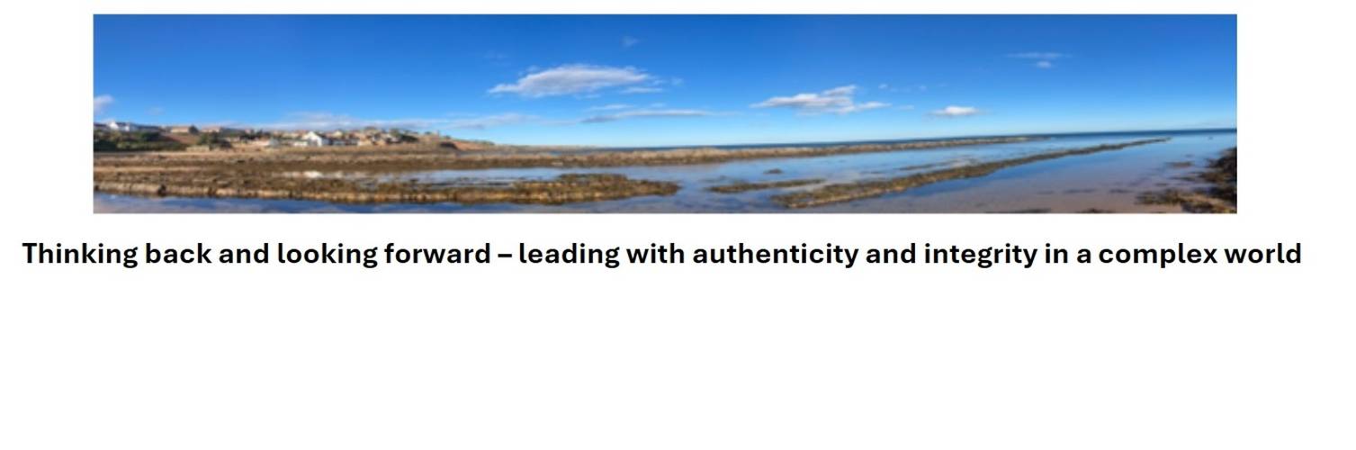 Panoramic view of a coastal landscape with rocky shoreline and blue sky, accompanied by text about leadership and integrity.