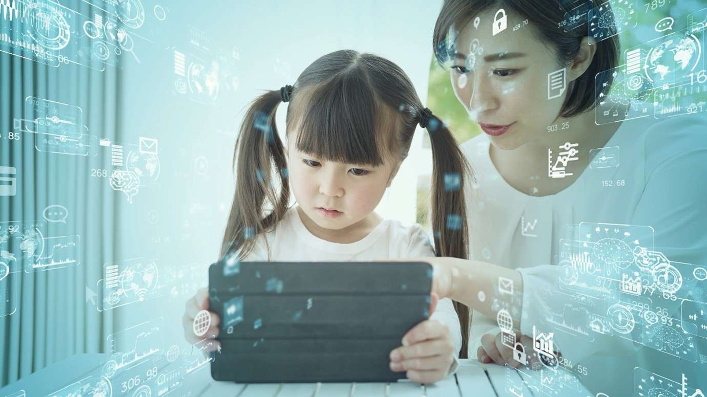 A woman and a young girl using a tablet, surrounded by digital technology icons and holograms, symbolizing connectivity and learning.