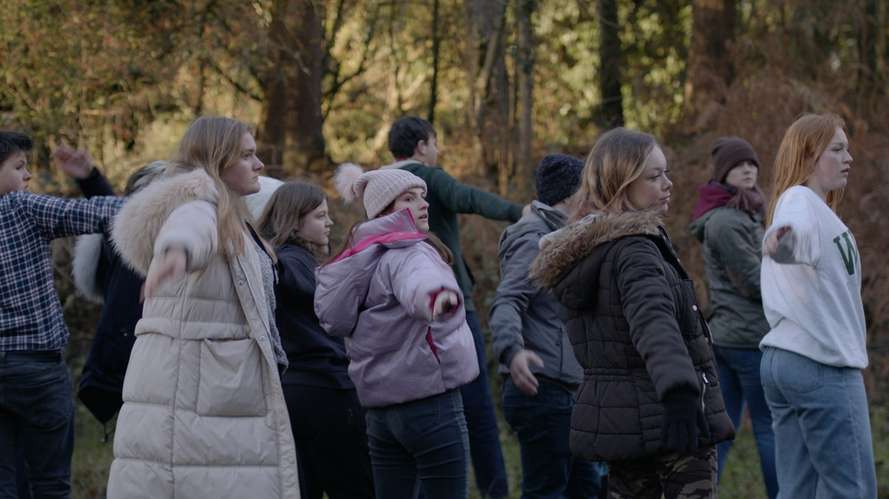Students stood in a field