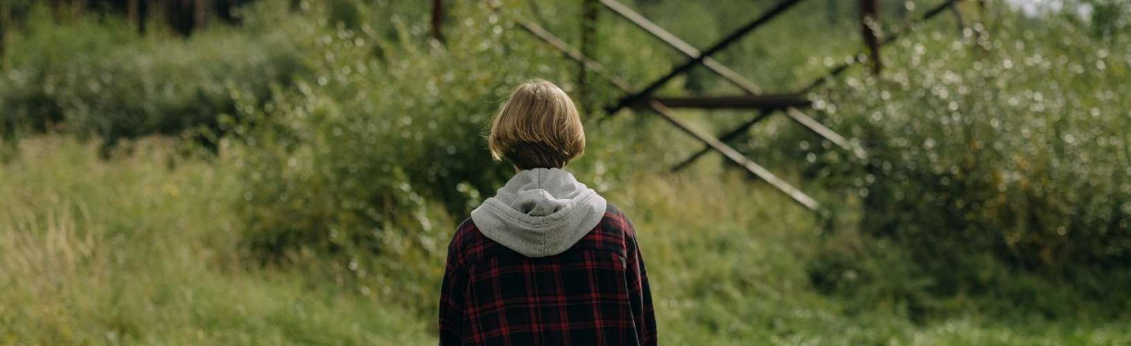 Teenager walking in a field