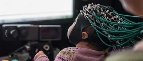baby with wires on head