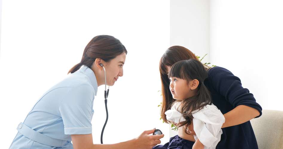 nurse checking child 