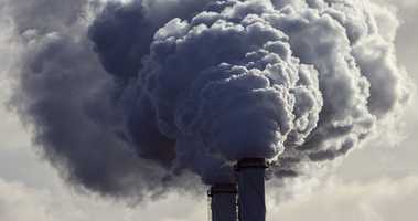 Chimney billowing out smoke