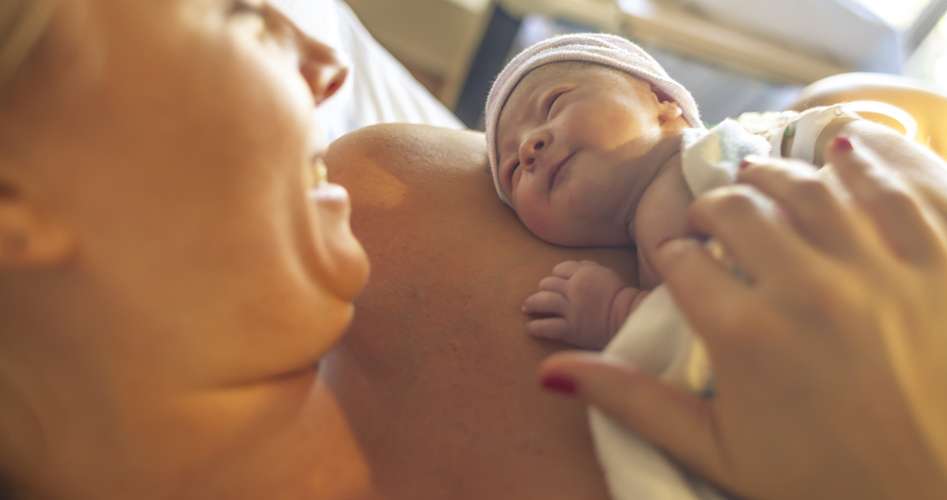 mother holding baby
