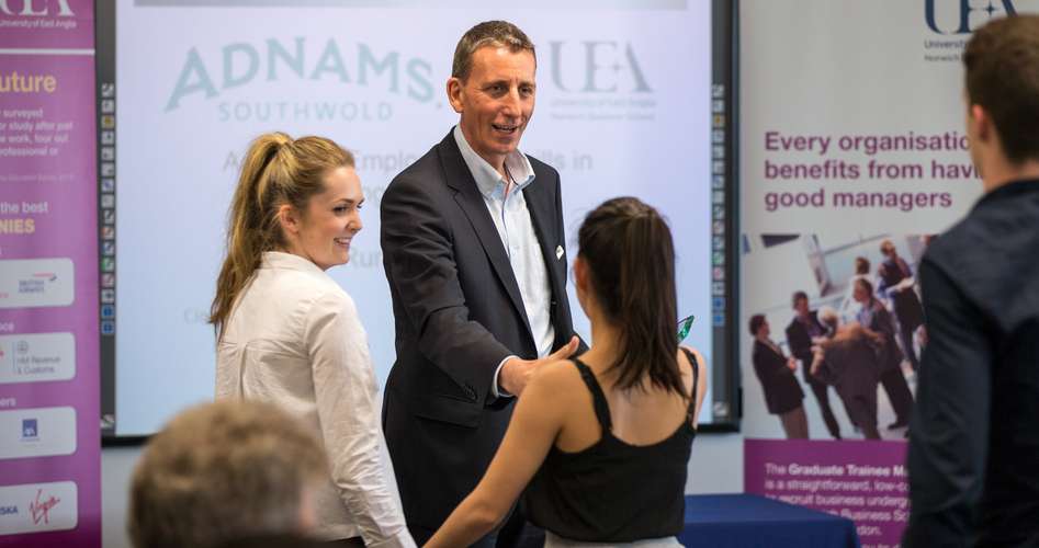 People shaking hands at business events