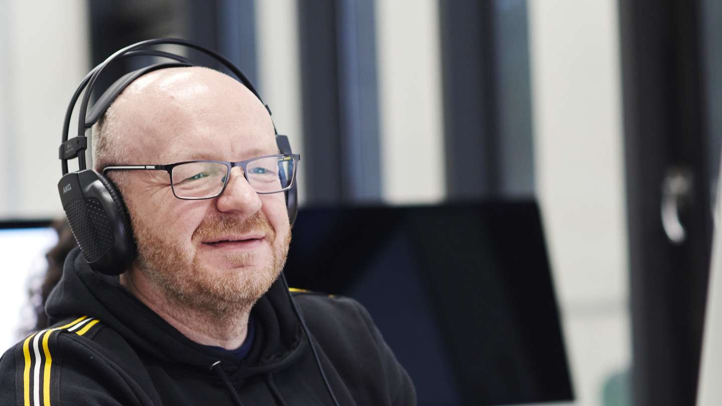 Mature_Student_listening_through_headphones-Header.jpg