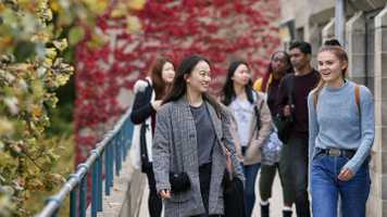 international-students-on-campus-walkway-smiling.jpg