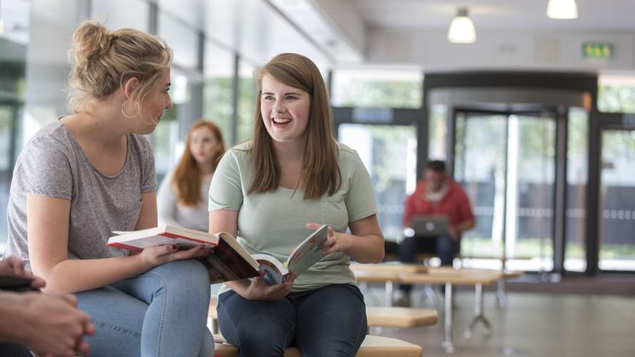 UEA Students in the reception of the Thomas Paine Study Centre on Campus, home to Norwich Business School