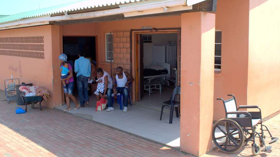 Men waiting in front of hospital