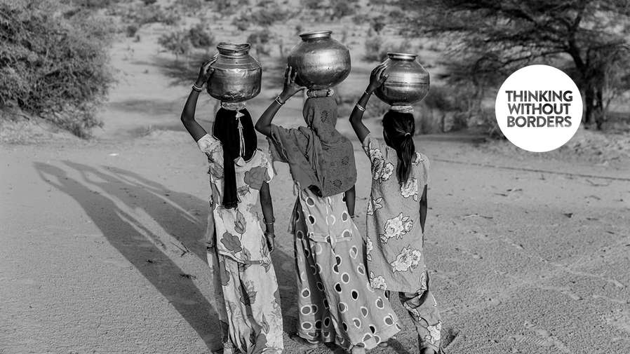 women carrying pots