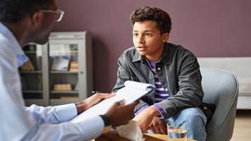 Picture of person speaking to a therapist
