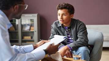 Picture of person speaking to a therapist