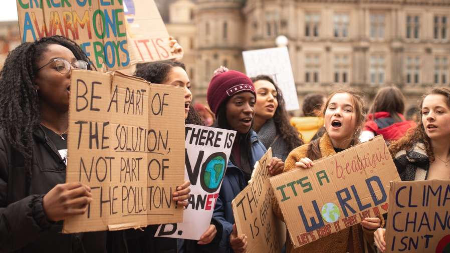 Climate protesters holding placards