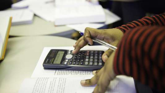 person on calculator