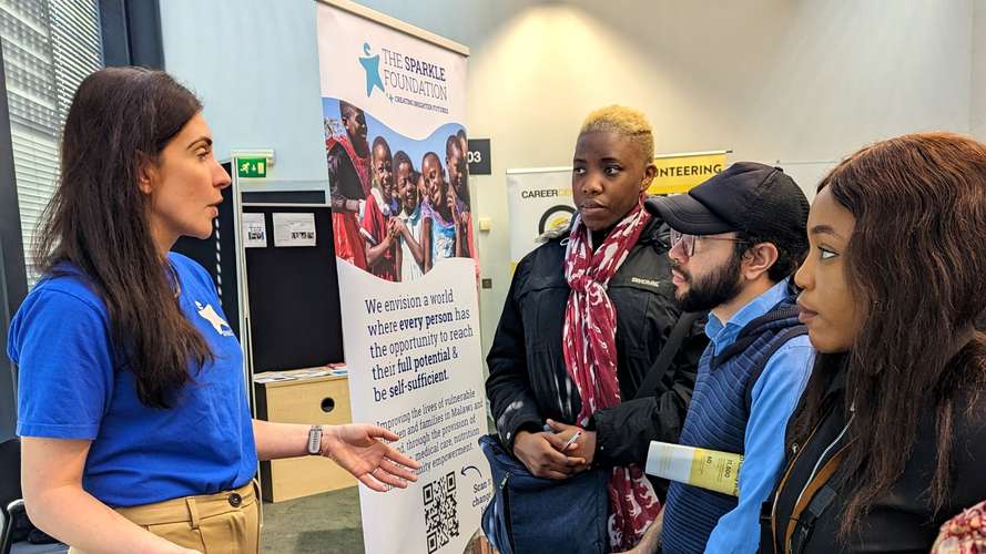 People attending a stand at Development Employability Week