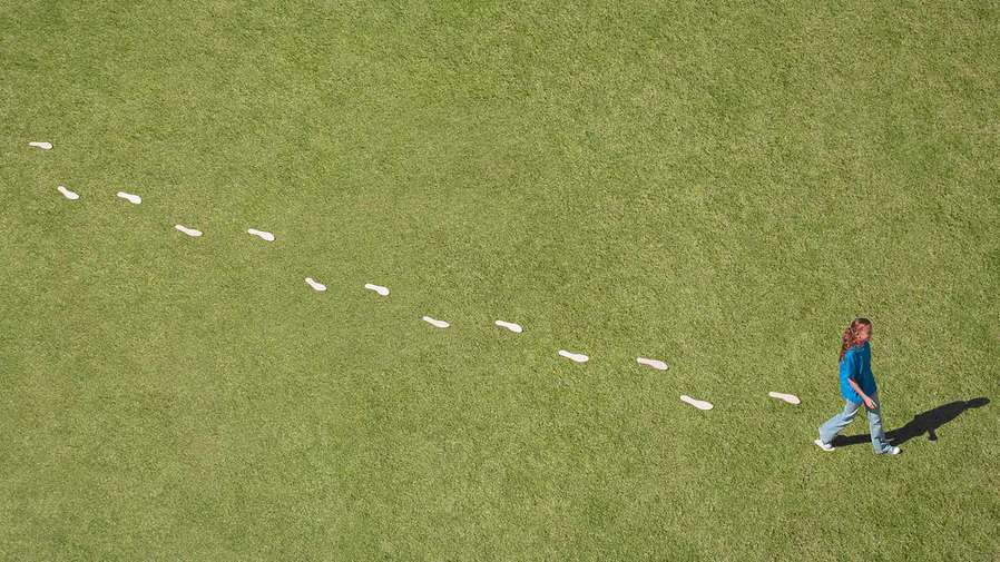 person walking and footprints