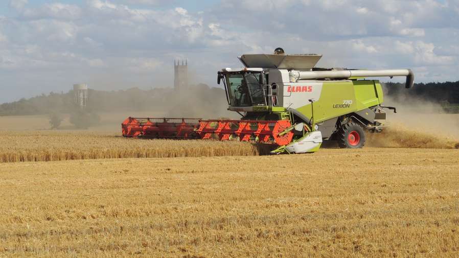 combine harvester in field