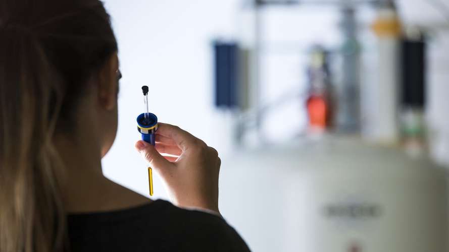 Student preparing their specimen to be placed in one of the state-of-the-art NMR Spectrometers on campus