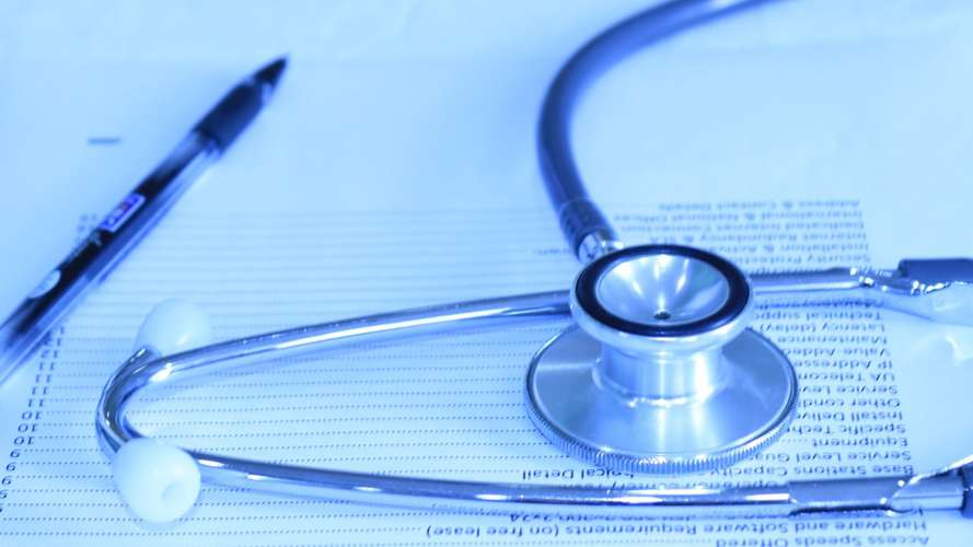 stethescope on blue paper