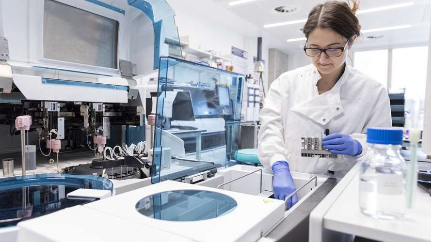 chemistry student in lab with equipment