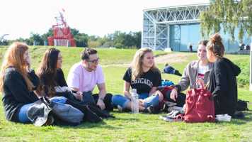 Header UEA Campus in summer . Students laughing 34075.jpg