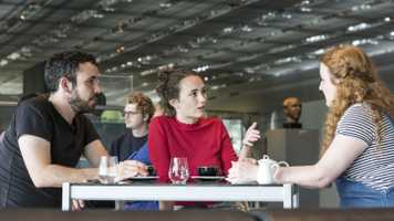 interdisciplinary-activities-students-sat-at-a-table.jpg