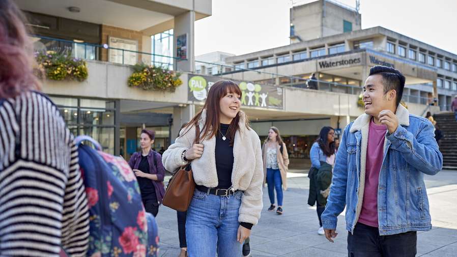 Students walking through the square at UEA