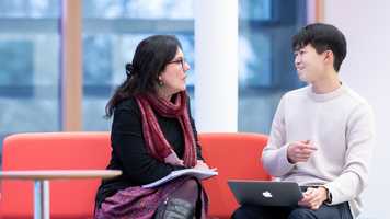 Two people in conversation 