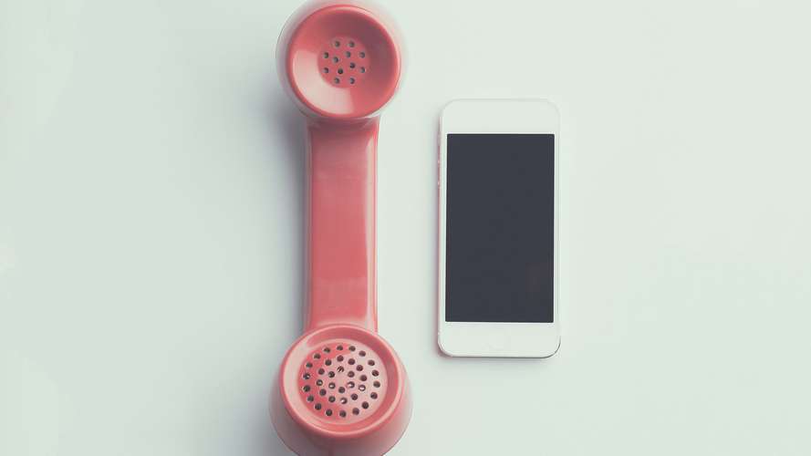 Landline phone next to an iPhone