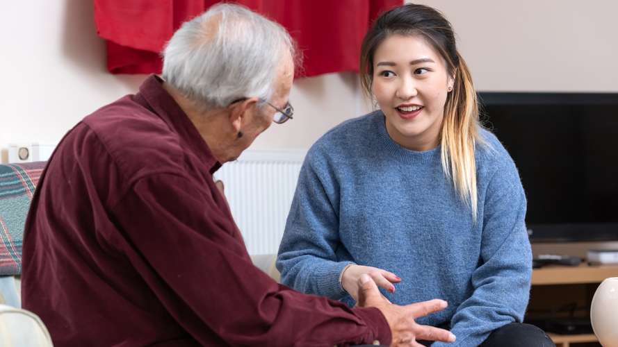 Student speaking to an older person