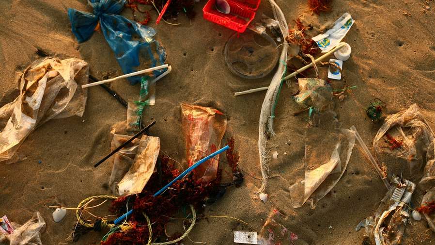 plastic trash on sand