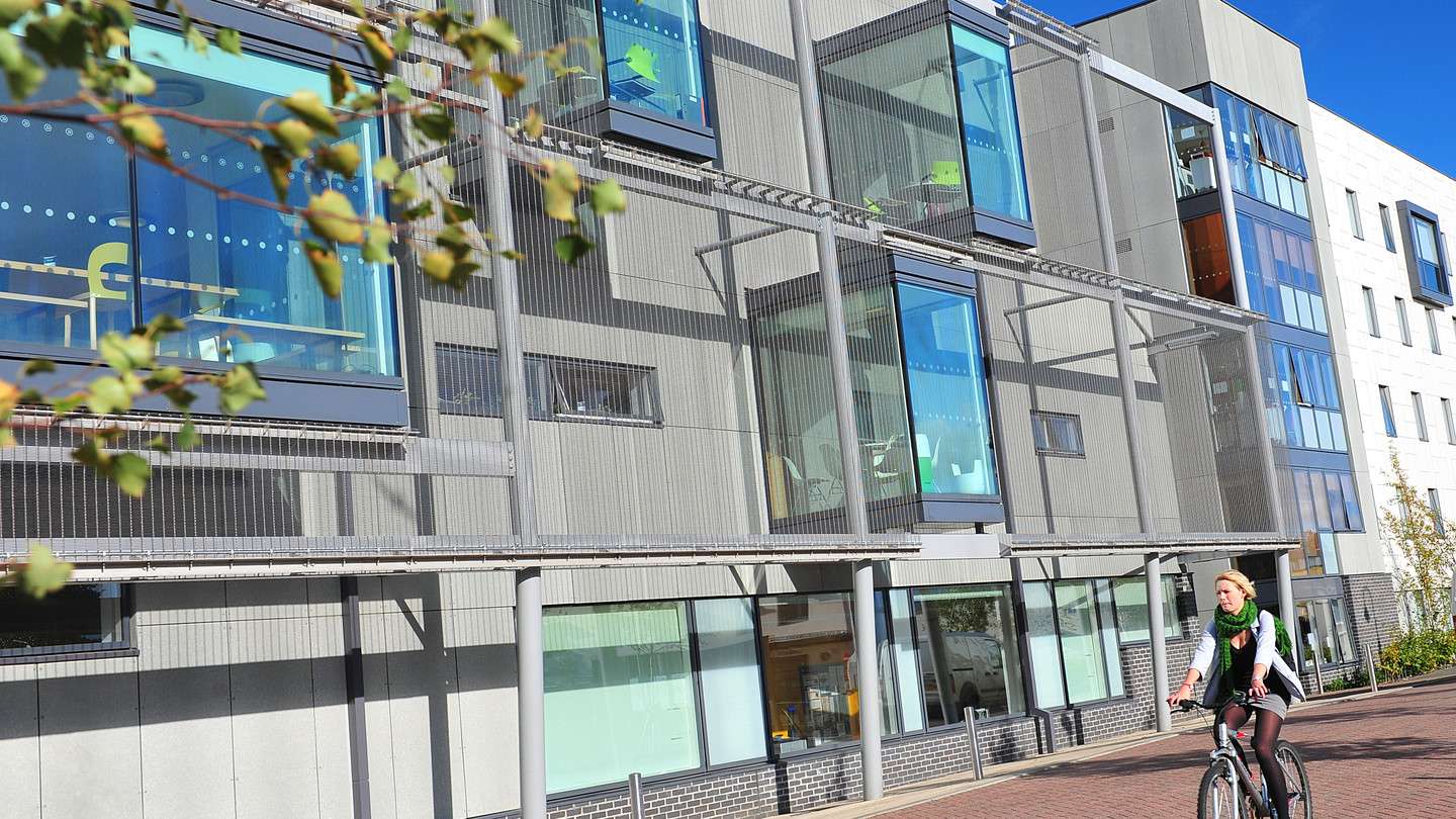 Cyclist outside INTO building