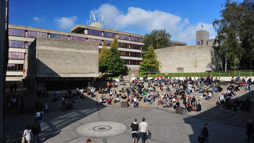 Students and staff on the UEA campus square
