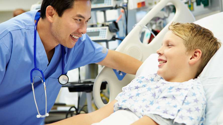 male nurse talking to boy